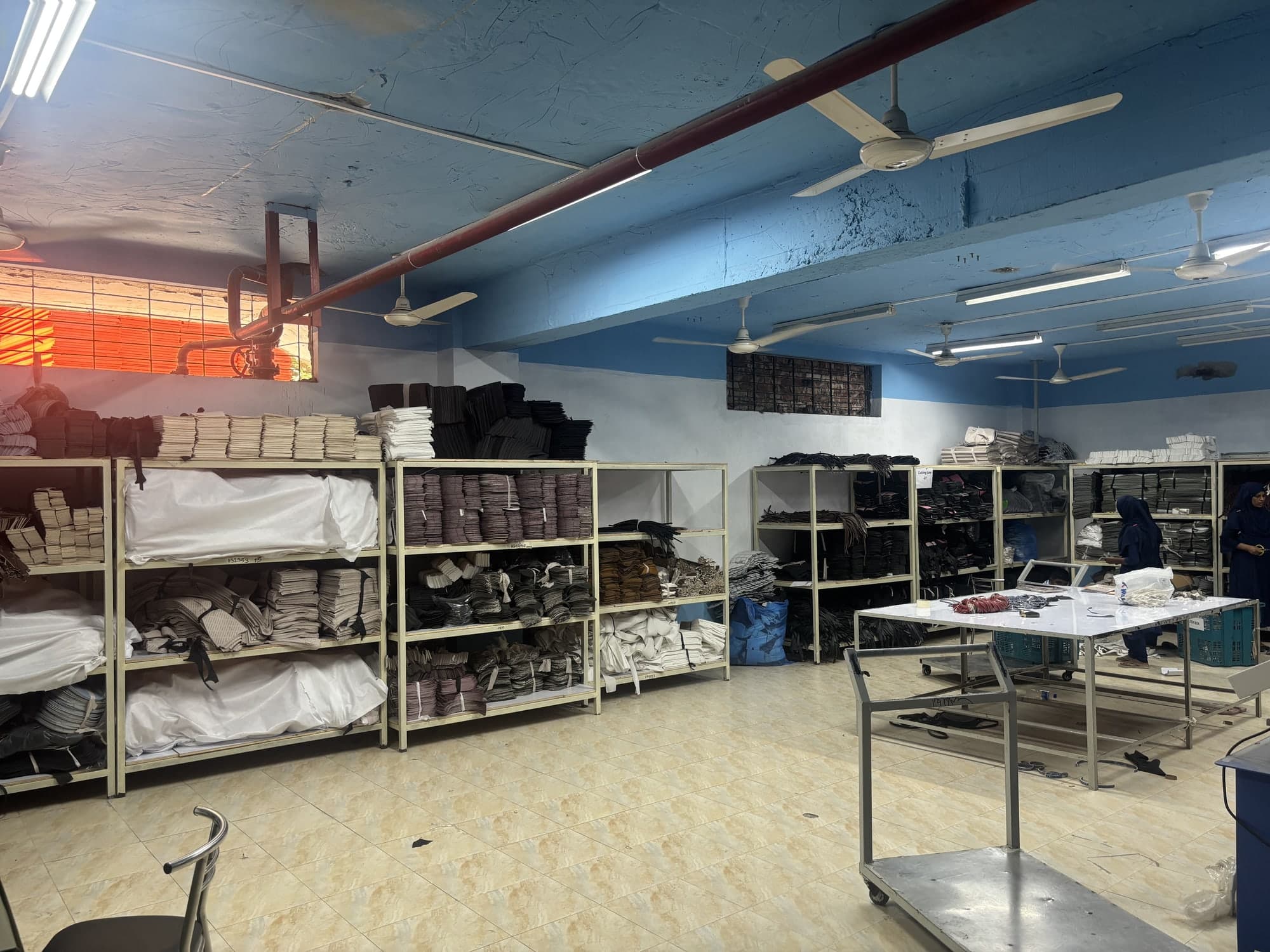 Rolls of canvas and fabric on warehouse shelving